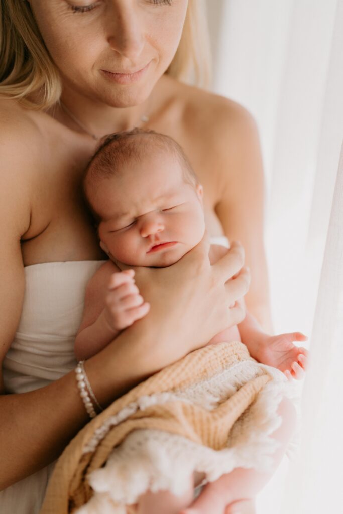 Mother holding her newborn baby