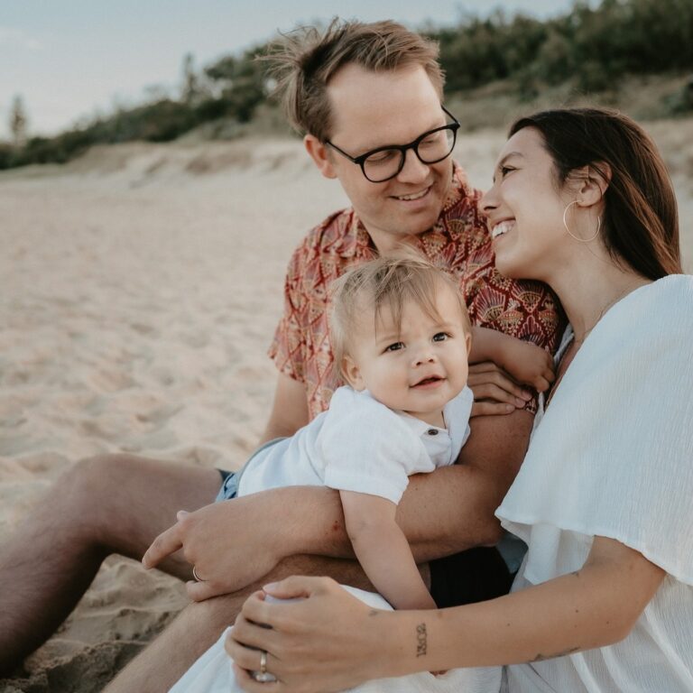 Extended family on the beach in winter sun