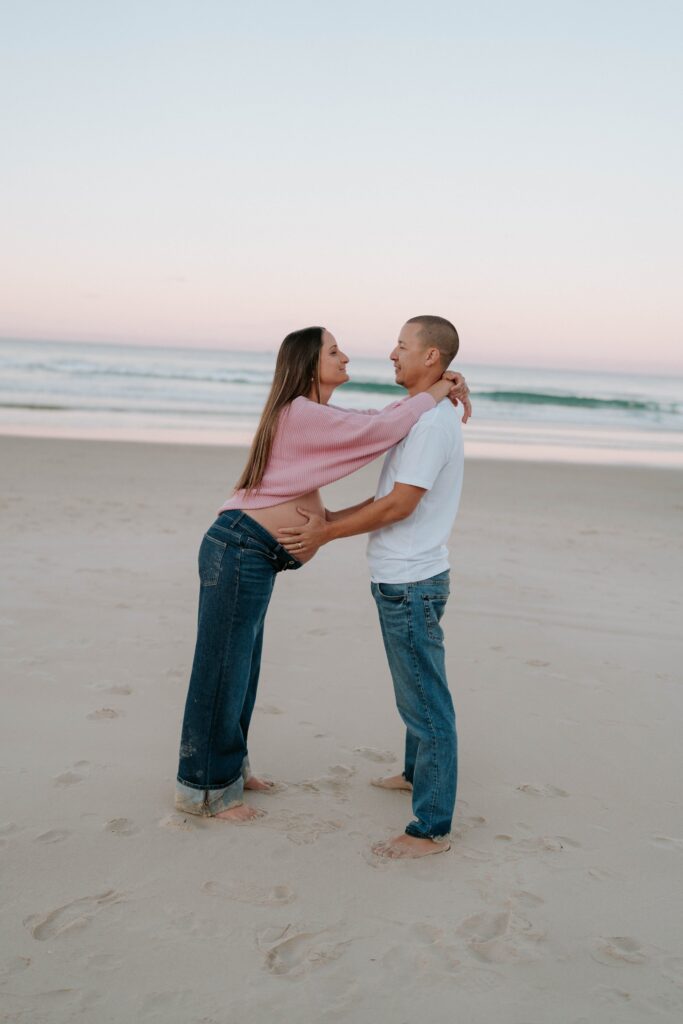 Maternity photo of a couple on the beach